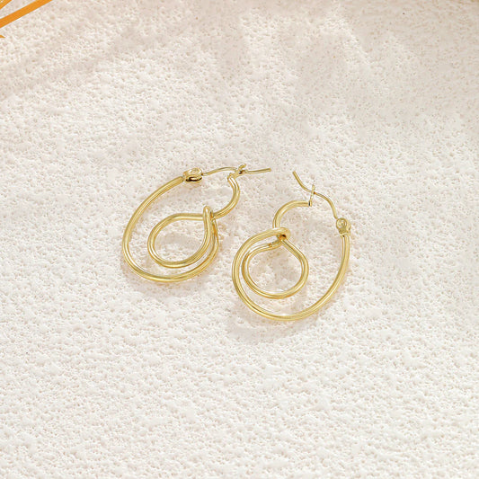 Boucles d'Oreilles Anneaux Irréguliers et Noués Doré