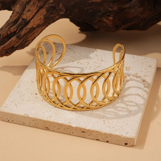 Bracelet jonc manchette ouvert au design géométrique en acier inoxydable doré