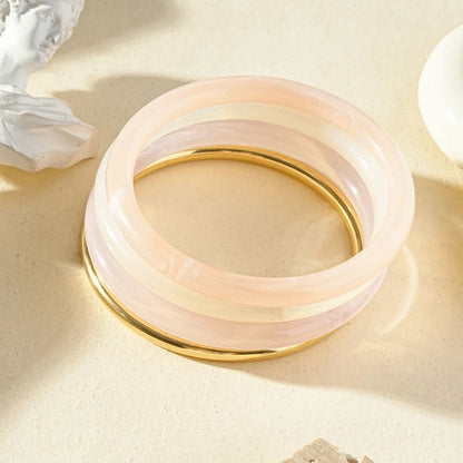 Lot de 4 bracelets joncs en acier inoxydable doré et en résine couleur pastel