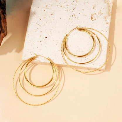 Boucles d'Oreilles Créoles 3 Anneaux Torsadés Dorés